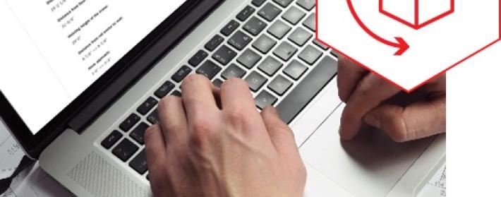 A person designing a crane on a laptop.